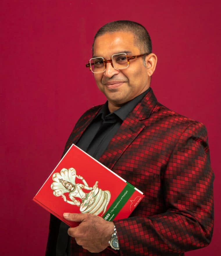 Kausthub Desikachar posing in red